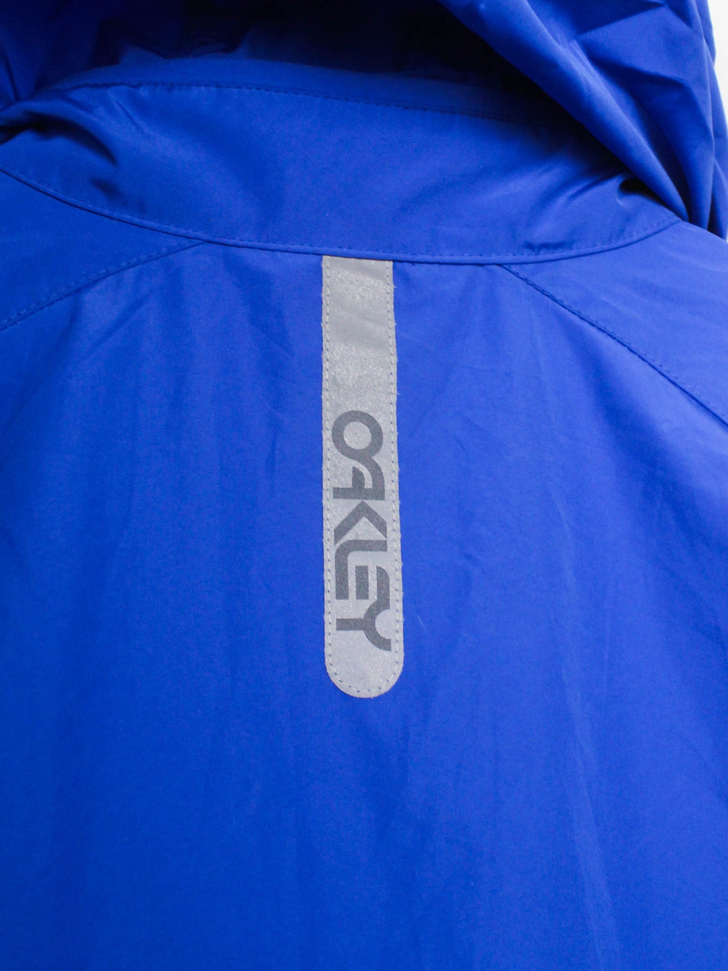 Блакитна вітровка Oakley