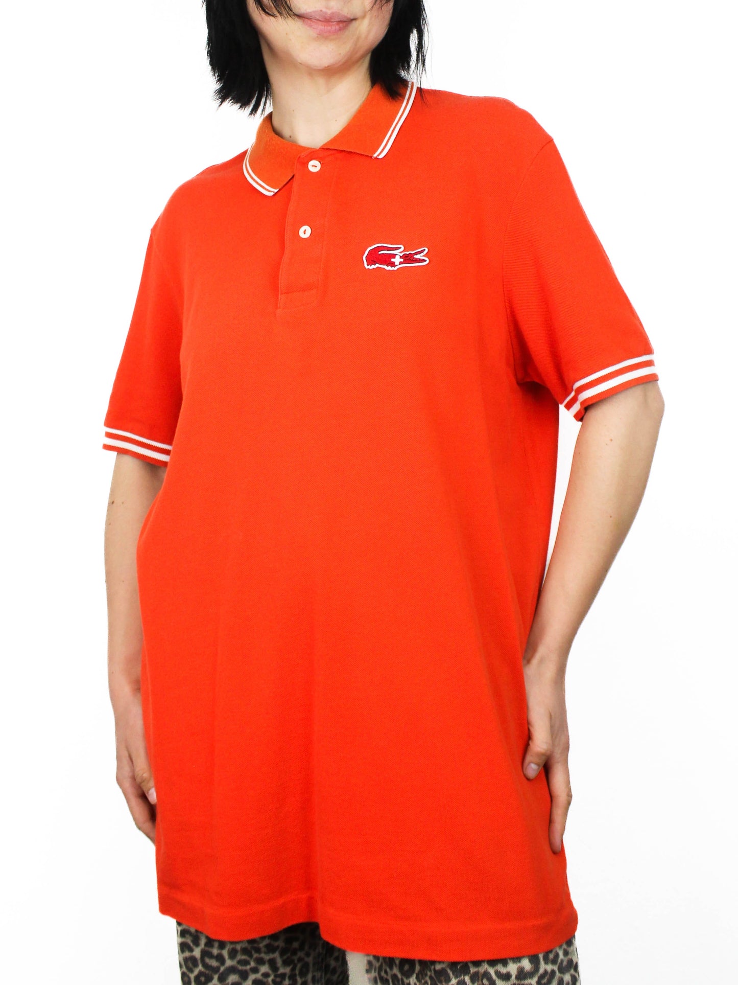 Помаранчеве поло Lacoste