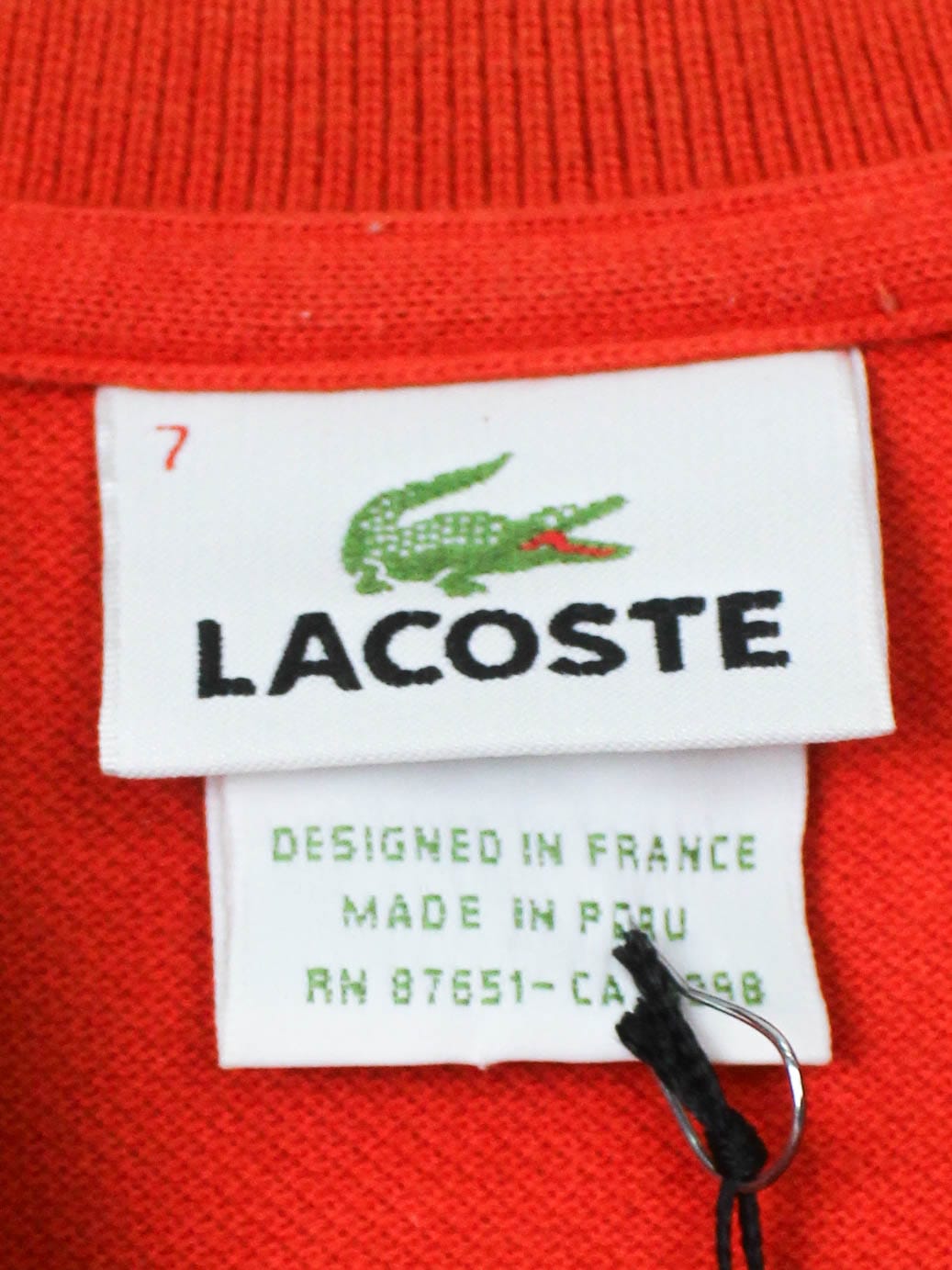Помаранчеве поло Lacoste