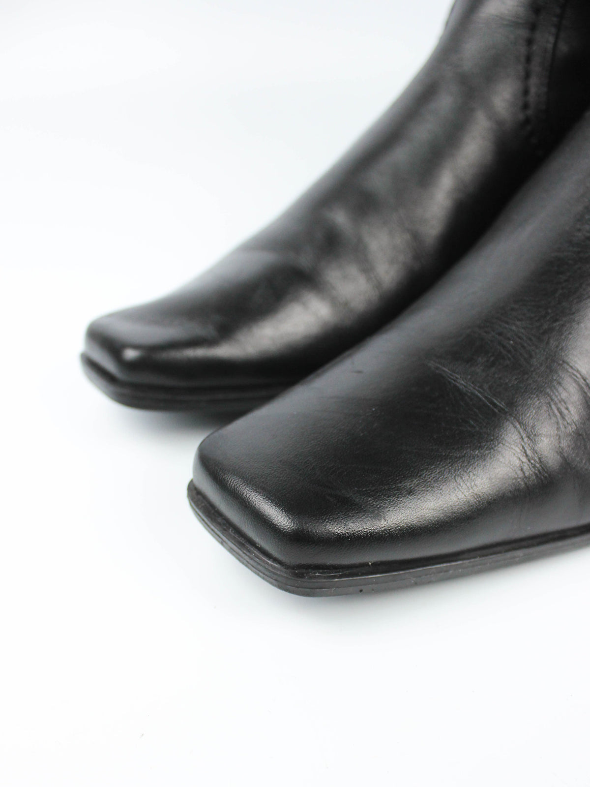 Black Leather Knee-High Boots with Buckle Details